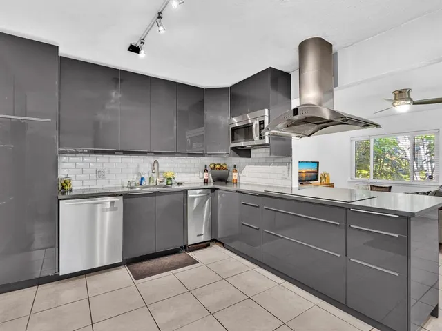 a kitchen with a sink and cabinets