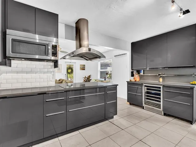 a dining room with furniture a chandelier and a rug