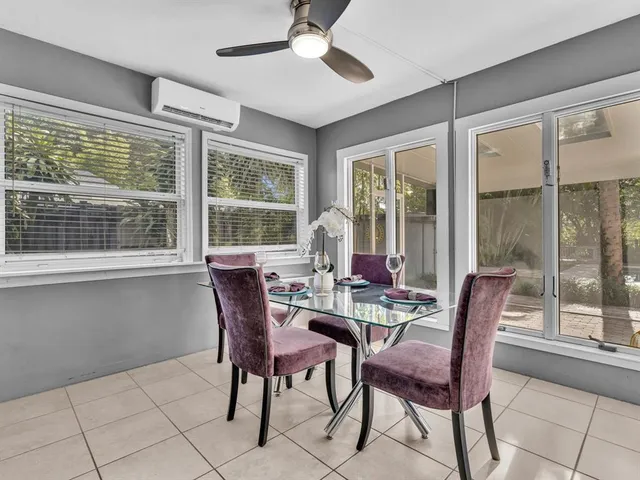 a bathroom with a granite countertop sink and mirror