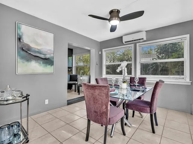 a bedroom with a bed and a night stand