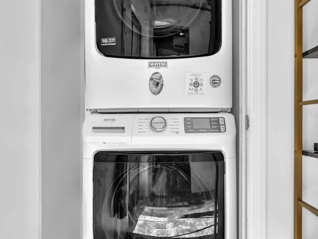 a view of a backyard with swimming pool