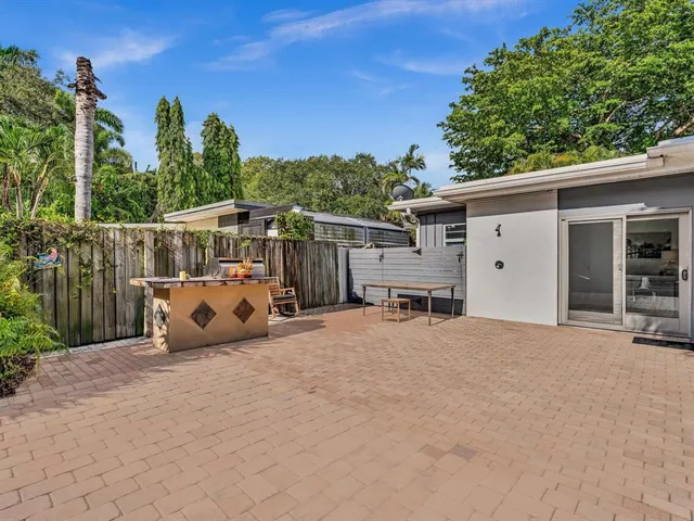 a view of a road with plants and trees