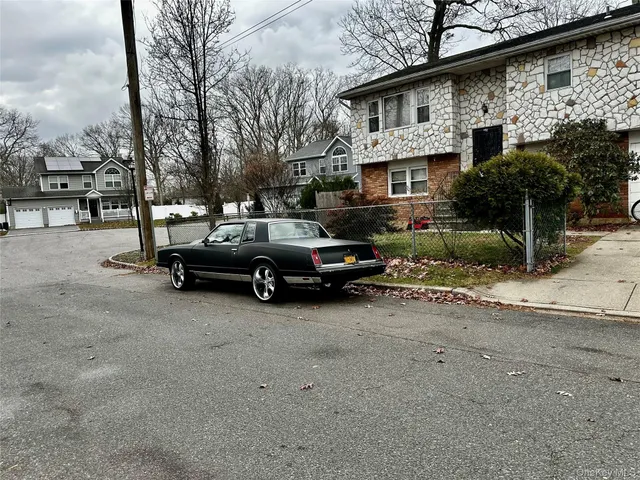 a view of a car parked in front of a house