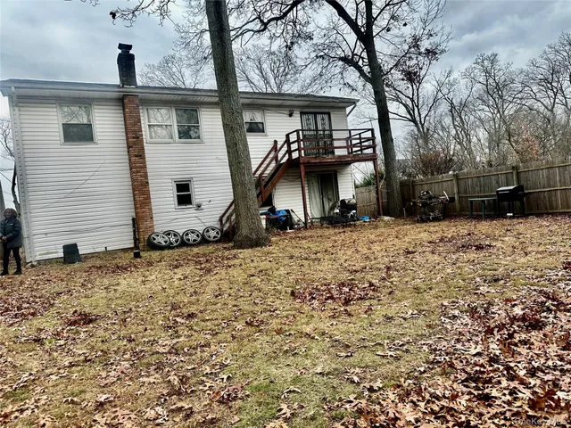 a view of a house with a snow on the road