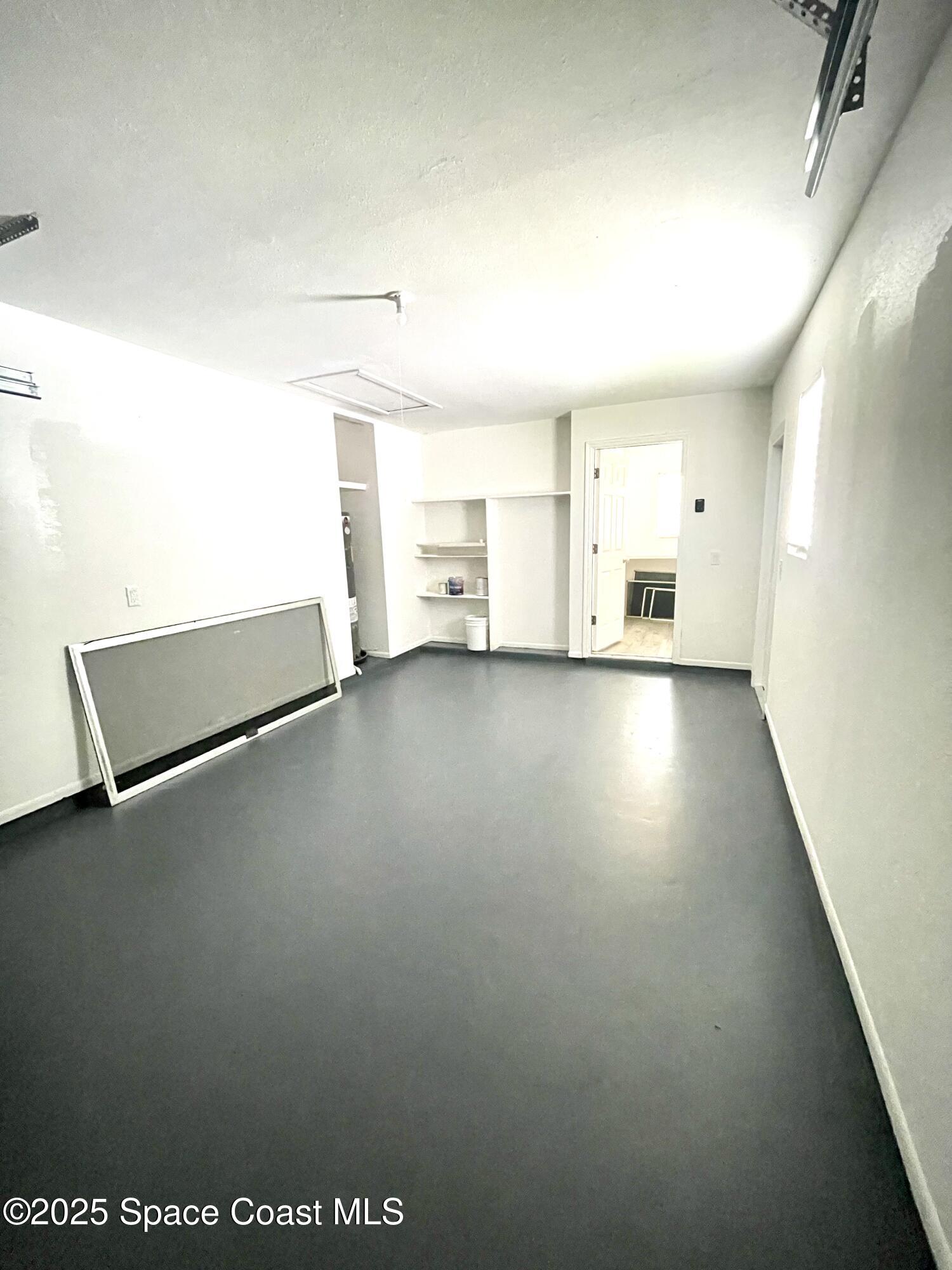 1186 Galty Circle Northeast, Unit 6 Palm Bay, FL 32905 - Photo 22 of 26 a view of an empty room with a window