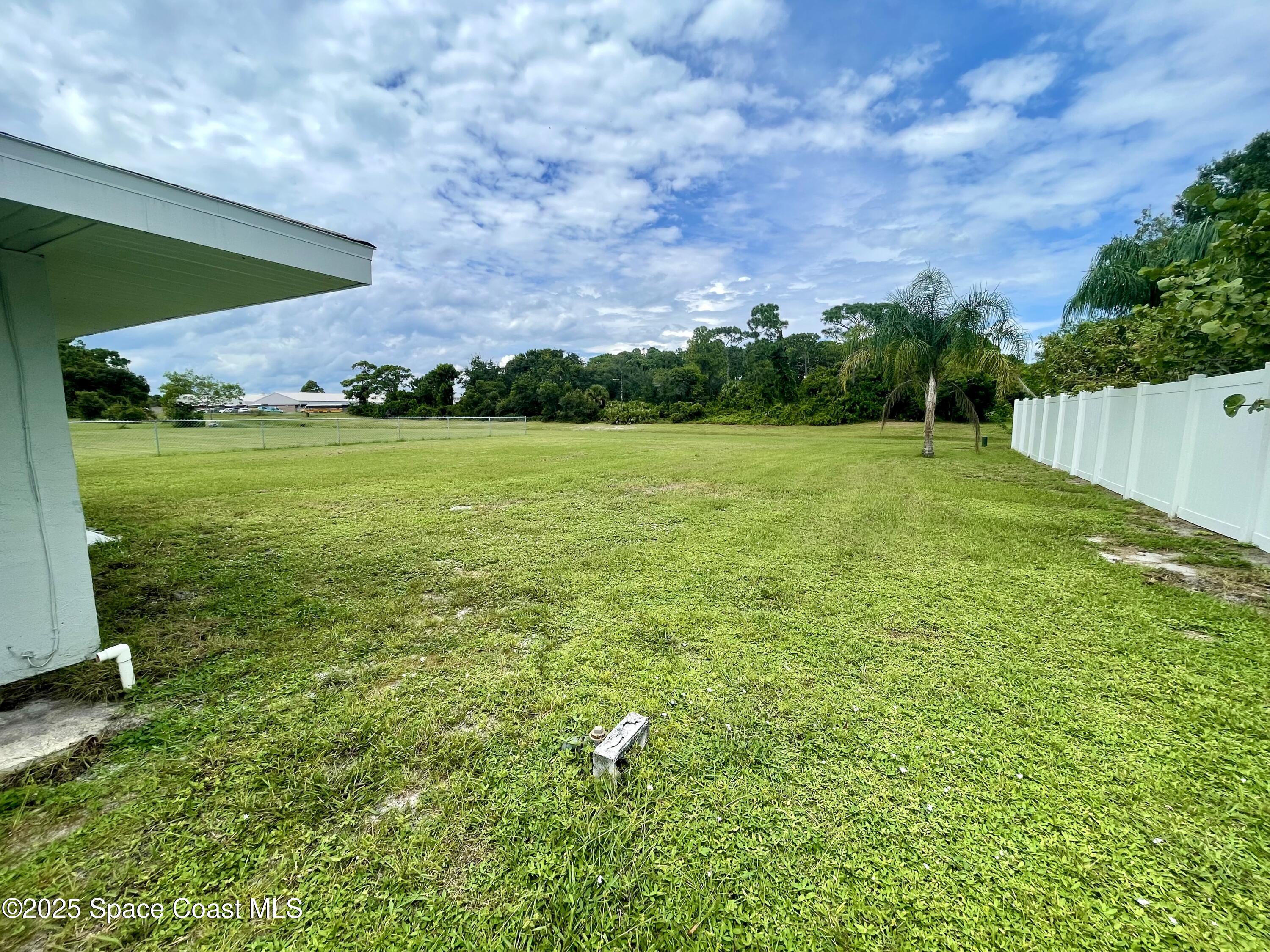 1186 Galty Circle Northeast, Unit 6 Palm Bay, FL 32905 - Photo 24 of 26 a view of outdoor space and yard