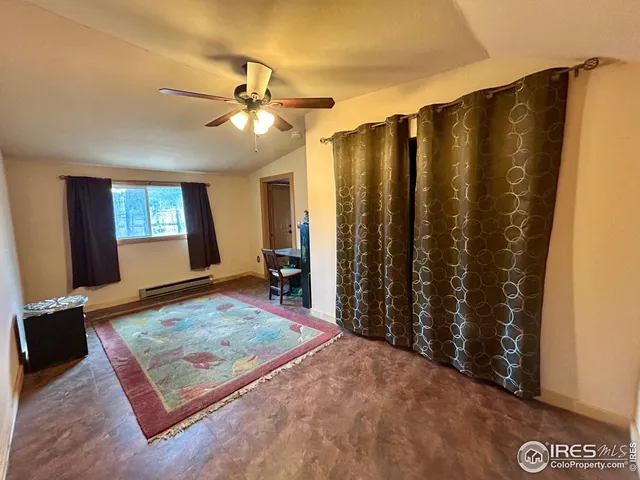 a view of a bedroom and window