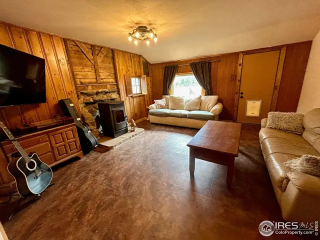 a bedroom with furniture and a flat screen tv