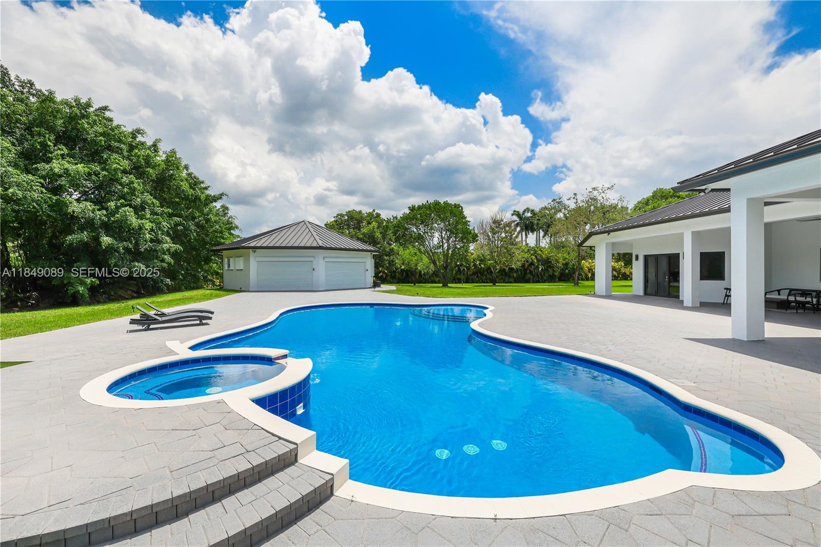 601 Ranch Road Weston, FL 33326 - Photo 46 of 75 Resort-style pool with brand new Diamond Brite finish, chlorine system, and heat pump spa.