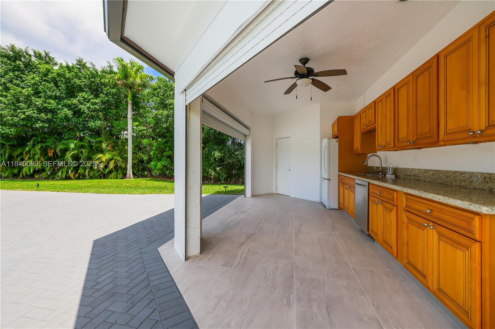 601 Ranch Road Weston, FL 33326 - Photo 52 of 75 Roll-up shutters for the outdoor kitchen, accordion shutters on all windows, and a roll-up shutter at the apartment entrance.