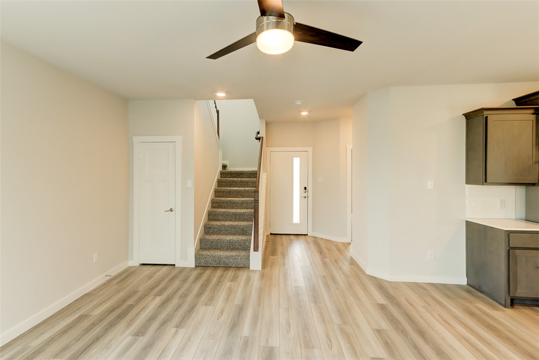 760 Double Mountain Road College Station, TX 77845 - Photo 3 of 26 a view of a room with wooden floor and ceiling fan