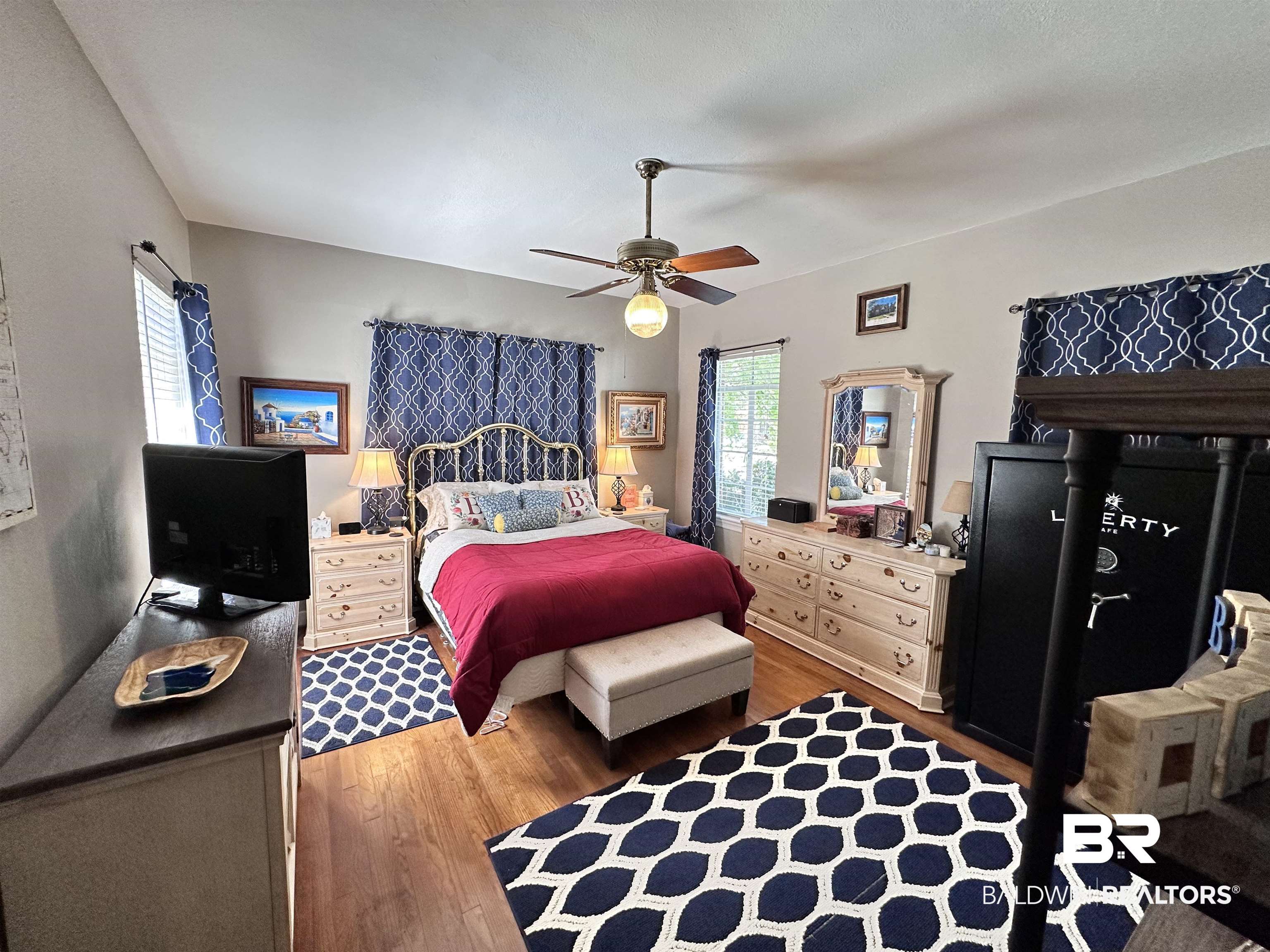 260 Siena Vista Street Mobile, AL 36607 - Photo 10 of 41 Bedroom featuring wood finished floors and a ceiling fan