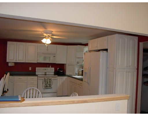 18 Jordan Road Billerica, MA 01821 - Photo 3 of 9 a kitchen with a refrigerator and a sink