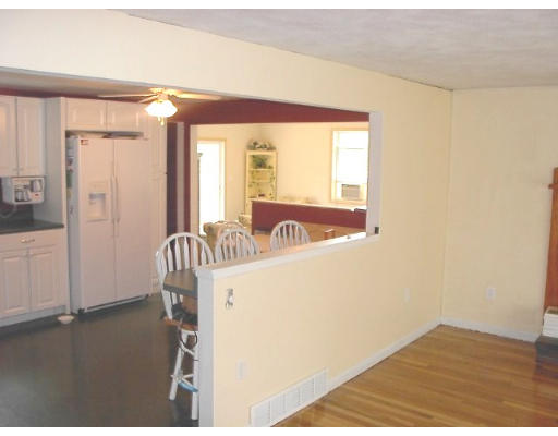 18 Jordan Road Billerica, MA 01821 - Photo 7 of 9 a view of a bedroom with wooden floor and windows