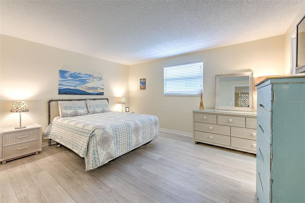 17200 Gulf Boulevard, Unit 401 North Redington Beach, FL 33708 - Photo 15 of 56 a bedroom with a bed and a window