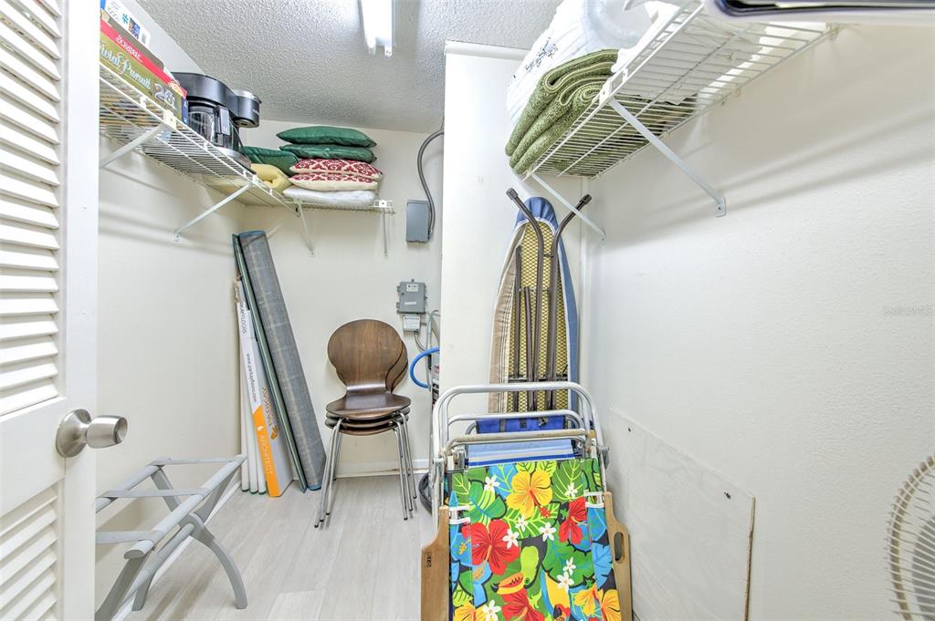 17200 Gulf Boulevard, Unit 401 North Redington Beach, FL 33708 - Photo 19 of 56 a view of walk in closet with clothes and shoes