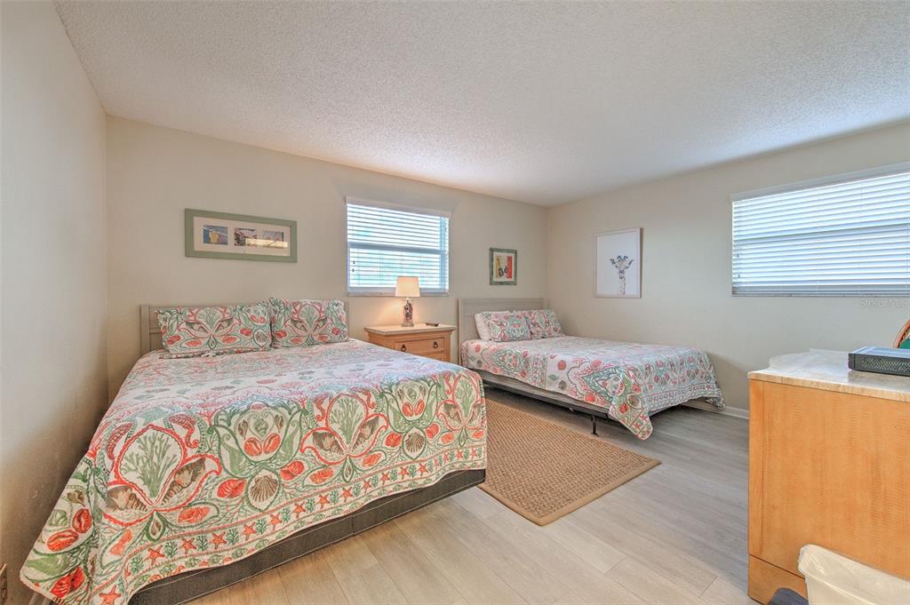 17200 Gulf Boulevard, Unit 401 North Redington Beach, FL 33708 - Photo 22 of 56 a bedroom with a bed and window