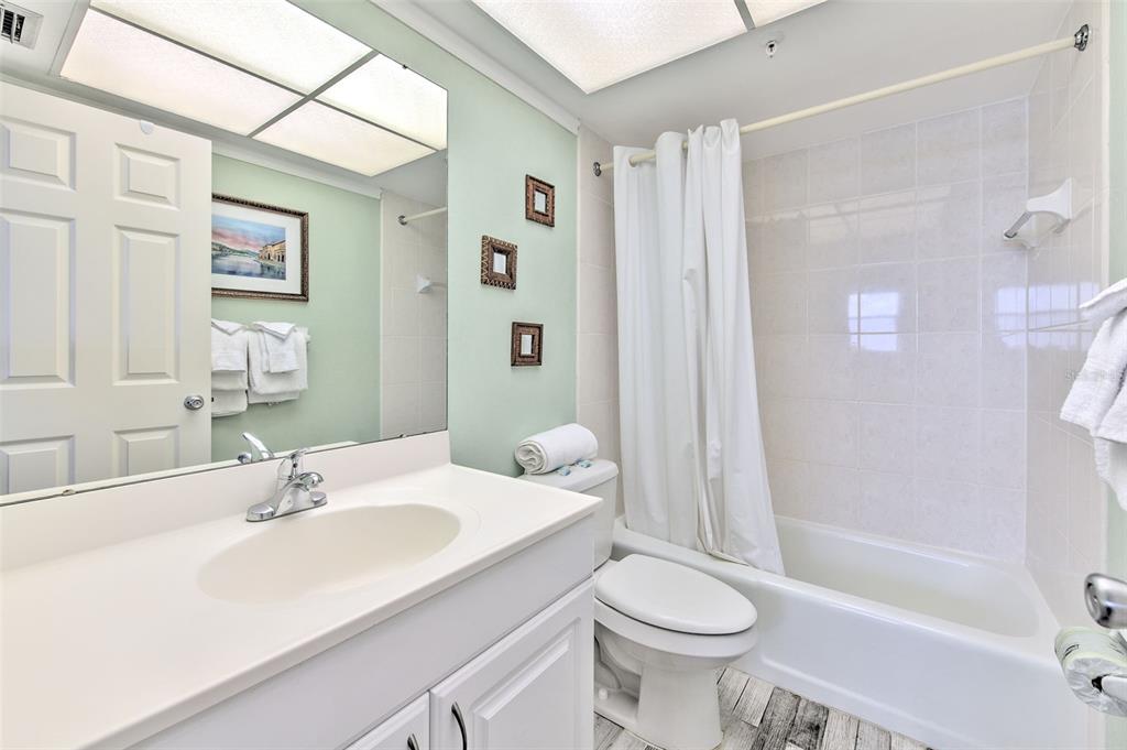 17200 Gulf Boulevard, Unit 401 North Redington Beach, FL 33708 - Photo 26 of 56 a bathroom with a sink toilet and shower