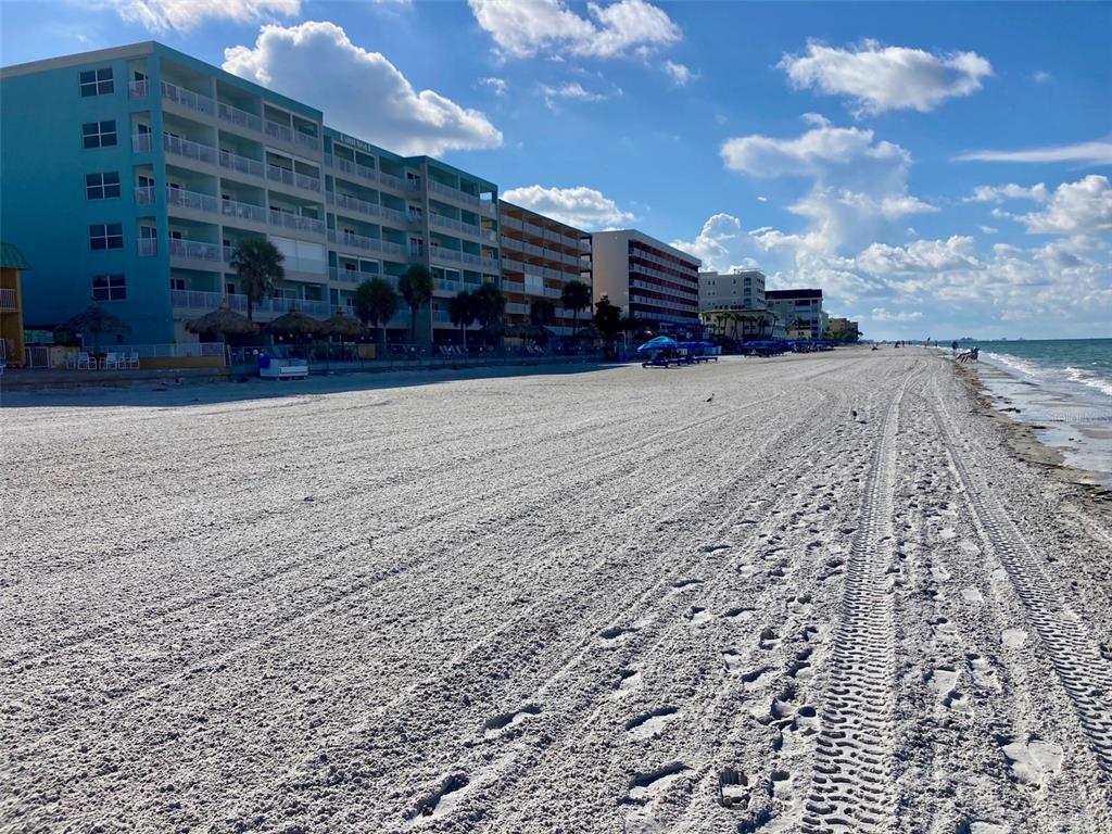 17200 Gulf Boulevard, Unit 401 North Redington Beach, FL 33708 - Photo 33 of 56 a view of a building with a yard