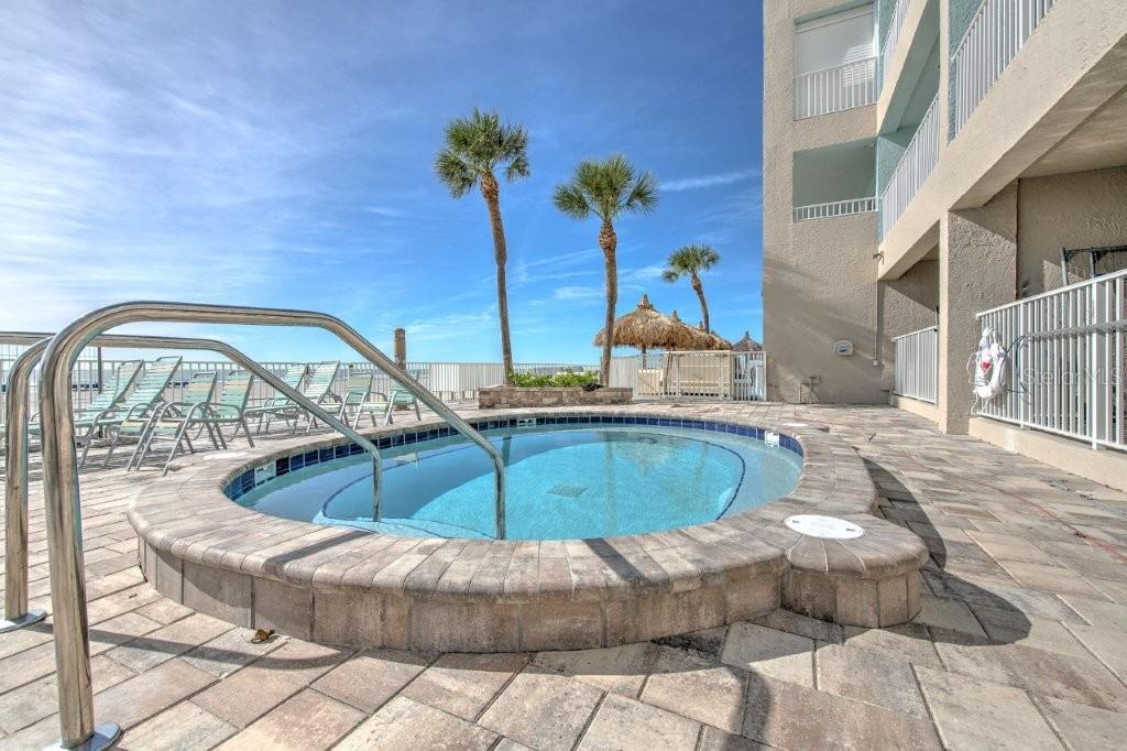 17200 Gulf Boulevard, Unit 401 North Redington Beach, FL 33708 - Photo 49 of 56 a view of a swimming pool with a yard