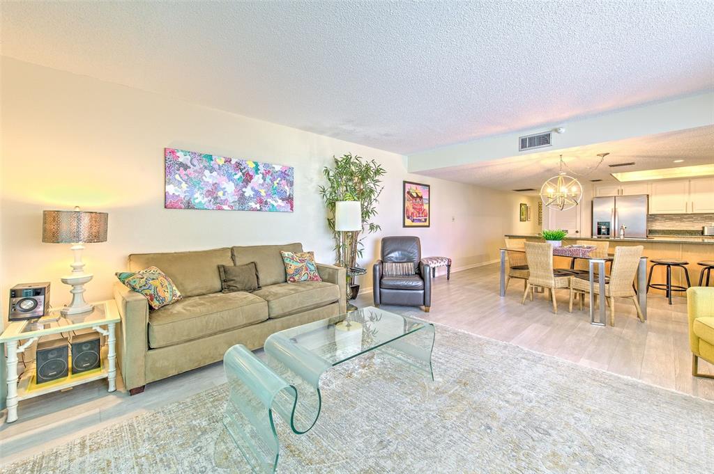 17200 Gulf Boulevard, Unit 401 North Redington Beach, FL 33708 - Photo 6 of 56 a living room with furniture and a table