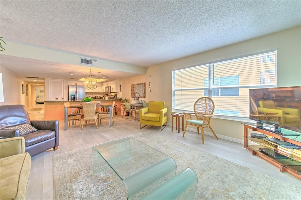 17200 Gulf Boulevard, Unit 401 North Redington Beach, FL 33708 - Photo 8 of 56 a living room with furniture and a table