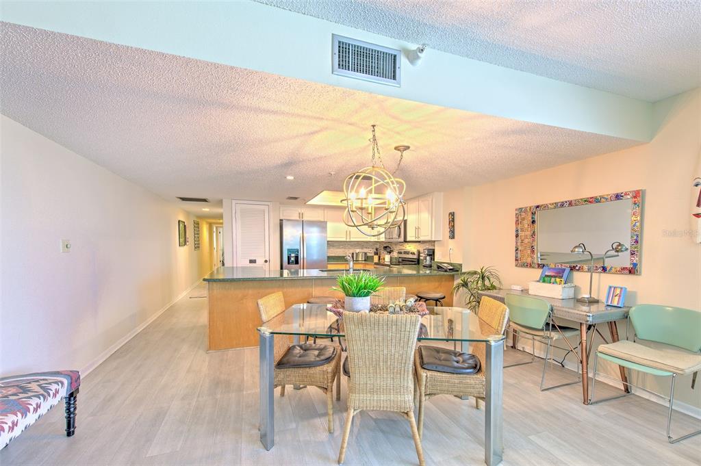 17200 Gulf Boulevard, Unit 401 North Redington Beach, FL 33708 - Photo 10 of 56 a view of a dining room with furniture window and wooden floor