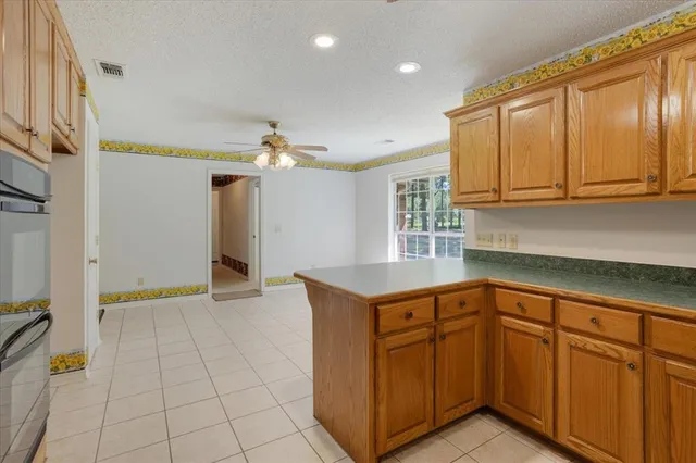 a kitchen with cabinets and appliances