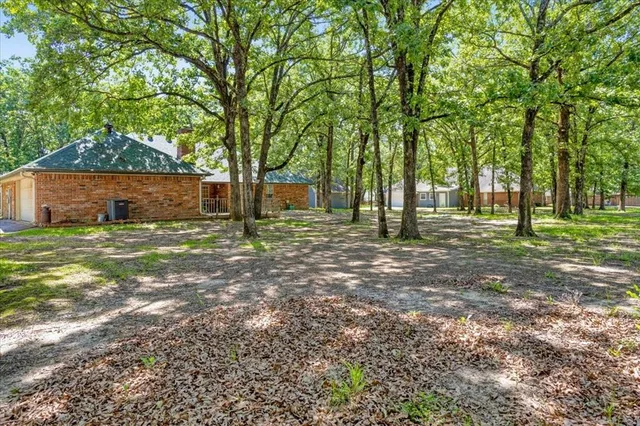 a backyard of a house with lots of green space