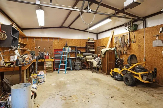 a view of a garage with parked cars