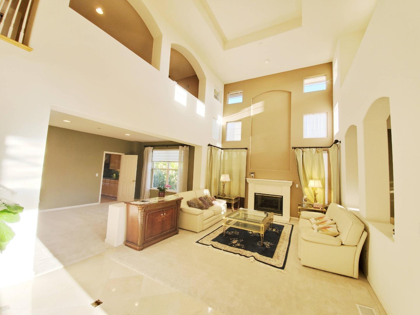 48887 Crestview Common, Unit CM Fremont, CA 94539 - Photo 3 of 5 a living room with furniture and a flat screen tv