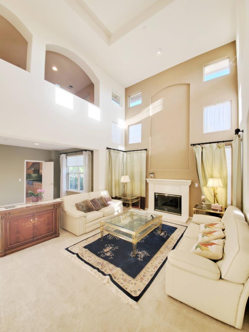 48887 Crestview Common, Unit CM Fremont, CA 94539 - Photo 4 of 5 a living room with furniture and a fireplace