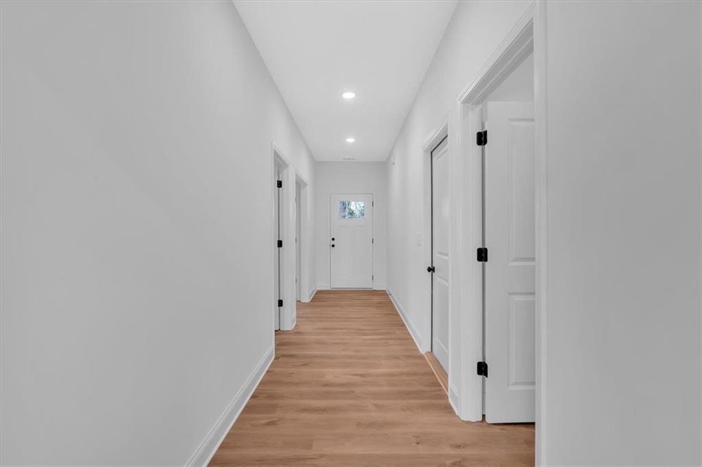 42 Dogwood Street Northeast Rome, GA 30161 - Photo 10 of 34 a view of a hallway with wooden floor and closet area