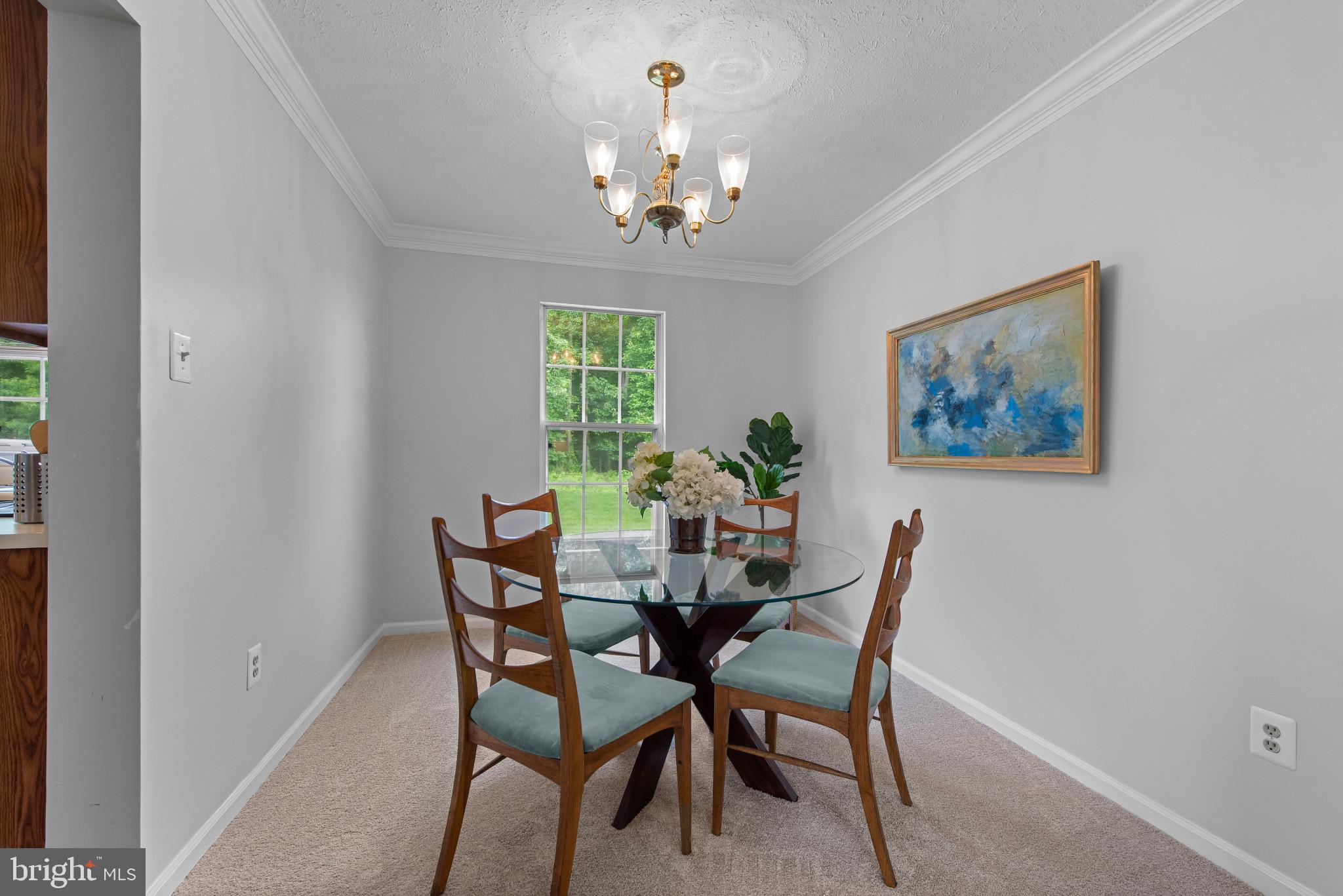 3107 Pouska Road Abingdon, MD 21009 - Photo 9 of 38 a dining room with furniture and a chandelier