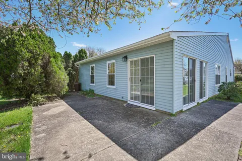 a view of a house with a yard and garage