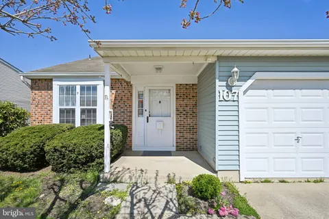 a front view of a house with a garage