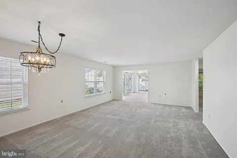 a view of empty room with windows