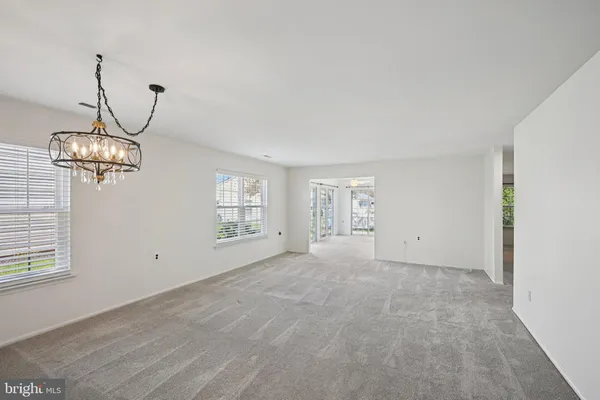 a view of empty room with windows