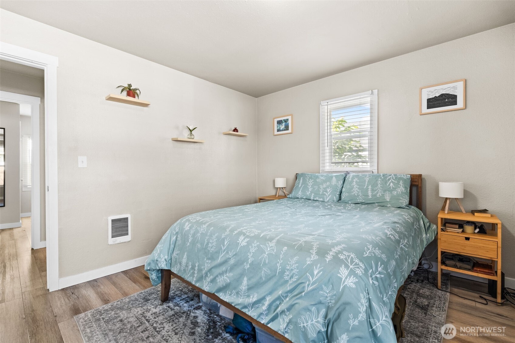 2719 South 70th Street Tacoma, WA 98409 - Photo 17 of 40 a bed sitting in a bedroom next to a window