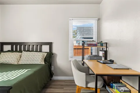 a view of a room with a table and chairs