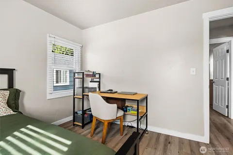 a workspace with furniture and wooden floor