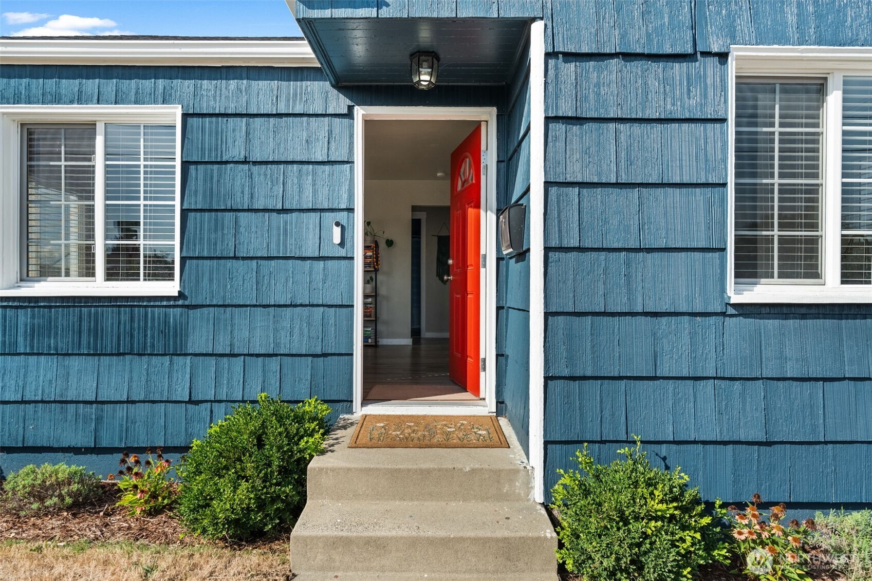 2719 South 70th Street Tacoma, WA 98409 - Photo 24 of 40 a front view of a house with a garden