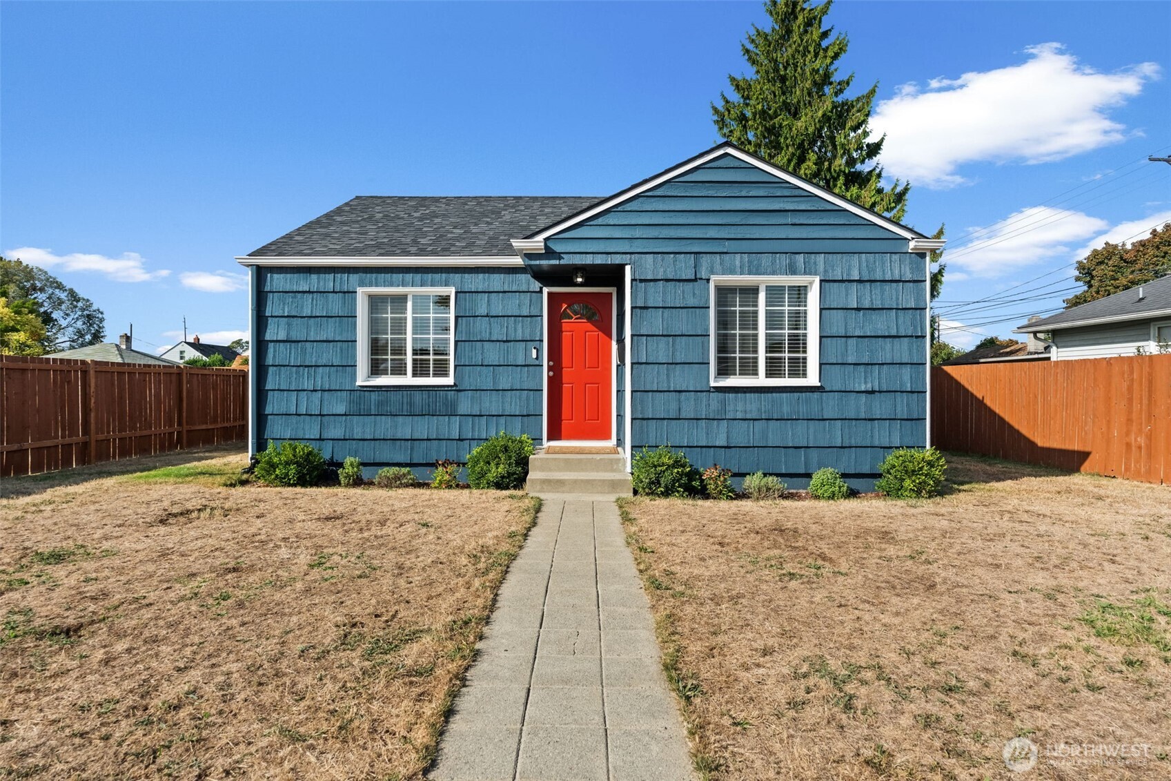 2719 South 70th Street Tacoma, WA 98409 - Photo 25 of 40 a front view of a house with a yard