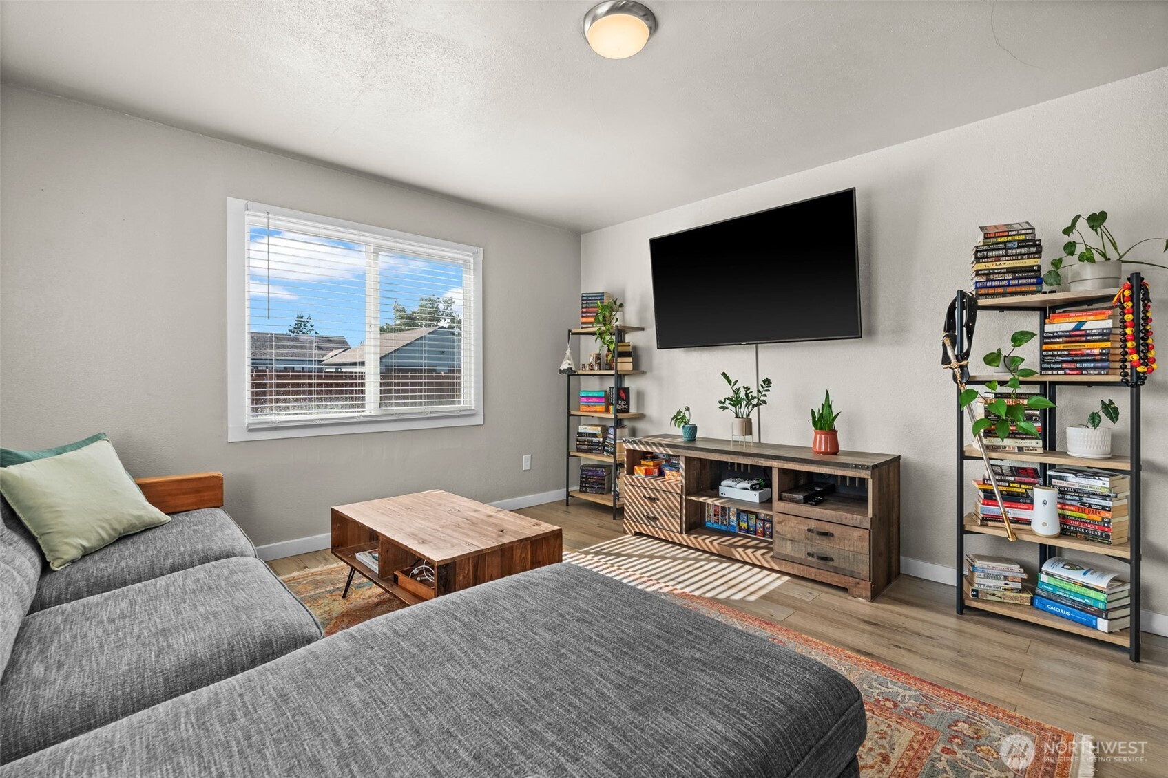 2719 South 70th Street Tacoma, WA 98409 - Photo 4 of 40 a living room with furniture and a flat screen tv