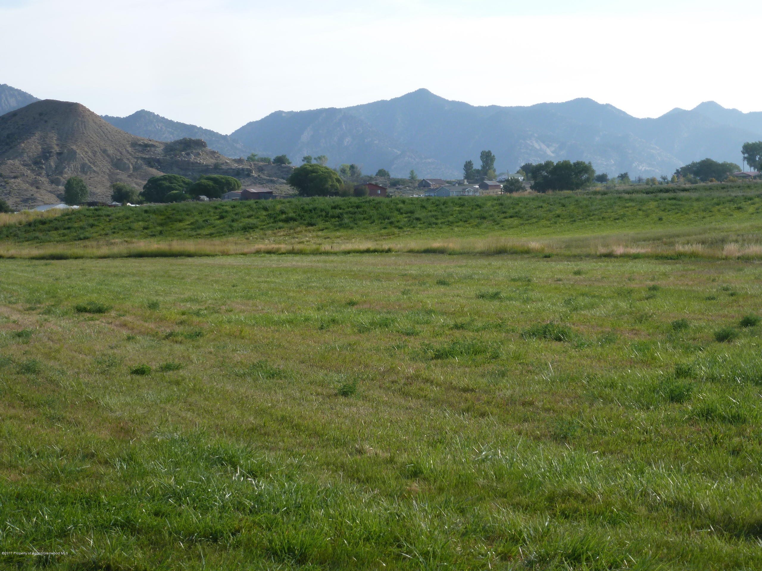 225 Rifle Co 81650 Rifle, CO 81650 - Photo 4 of 4 a view of a lush green hillside and houses