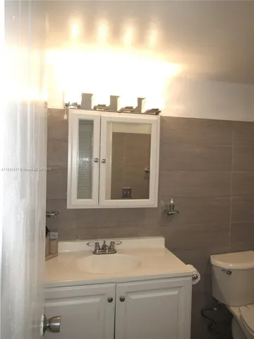 a bathroom with a shower and a bath tub