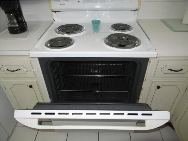 an empty room with window and hallway