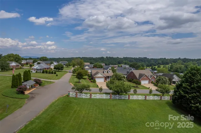 a view of a garden with a building in the background