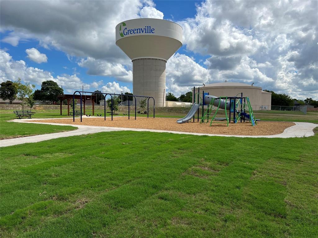 704 Ransom Way Greenville, TX 75402 - Photo 20 of 23 Community play area with a yard