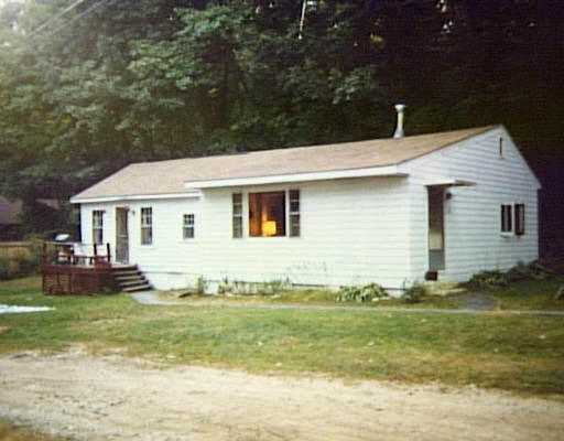 216 Turkey Hill Road Rutland, MA 01543 - Photo 1 of 1 a view of a white house with a big yard potted plants and large tree